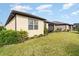Large backyard with green grass and partial home view at 672 Cordoba Dr, Davenport, FL 33837