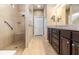 Large bathroom with walk-in shower, double vanity, and granite countertop at 672 Cordoba Dr, Davenport, FL 33837