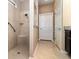 Bathroom features a walk-in shower and double vanity at 672 Cordoba Dr, Davenport, FL 33837