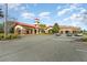 Community clubhouse with parking and landscaping at 672 Cordoba Dr, Davenport, FL 33837
