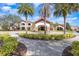 Community clubhouse entrance with landscaping at 672 Cordoba Dr, Davenport, FL 33837
