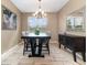 Dining room with a dark wood table and chandelier at 672 Cordoba Dr, Davenport, FL 33837
