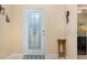 Front entry with a glass door and small side table at 672 Cordoba Dr, Davenport, FL 33837