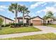 Single-Gathering home with a two-car garage and lush landscaping at 672 Cordoba Dr, Davenport, FL 33837