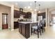 Kitchen features granite countertops, stainless steel appliances, and an island at 672 Cordoba Dr, Davenport, FL 33837