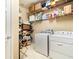 Laundry room with washer, dryer and ample storage at 672 Cordoba Dr, Davenport, FL 33837