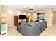 Spacious living area with a sectional sofa and large TV at 672 Cordoba Dr, Davenport, FL 33837