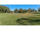 Spacious backyard with a pond view and lush green grass at 762 S Edgemon Ave, Winter Springs, FL 32708