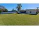 Spacious backyard with grassy area and home view at 762 S Edgemon Ave, Winter Springs, FL 32708