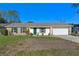 Brick ranch house with a two-car garage and a spacious yard at 762 S Edgemon Ave, Winter Springs, FL 32708