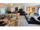 Open kitchen boasts granite countertops and flows into the living area at 762 S Edgemon Ave, Winter Springs, FL 32708