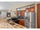 Modern kitchen with granite countertops and stainless steel appliances at 762 S Edgemon Ave, Winter Springs, FL 32708