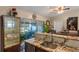 Kitchen with granite countertops, stainless steel appliances, and island at 762 S Edgemon Ave, Winter Springs, FL 32708