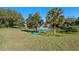 Peaceful lake view with lush greenery and a small boat at 762 S Edgemon Ave, Winter Springs, FL 32708
