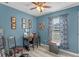 Bright home office with built-in desk and hardwood floors at 762 S Edgemon Ave, Winter Springs, FL 32708