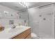 Bright bathroom with single sink vanity and shower at 815 Ocean Shore Blvd # U9A, Ormond Beach, FL 32176