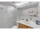 Bathroom with shower, vanity, and tiled walls at 815 Ocean Shore Blvd # U9A, Ormond Beach, FL 32176