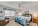 Bright bedroom with king-size bed and wicker furniture at 815 Ocean Shore Blvd # U9A, Ormond Beach, FL 32176