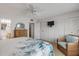 Bedroom with king bed, built-in shelving and view of bathroom at 815 Ocean Shore Blvd # U9A, Ormond Beach, FL 32176
