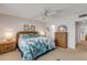 King bedroom with ceiling fan and ample closet space at 815 Ocean Shore Blvd # U9A, Ormond Beach, FL 32176