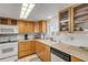 Clean kitchen with light wood cabinets, white appliances, and ample counter space at 815 Ocean Shore Blvd # U9A, Ormond Beach, FL 32176