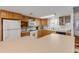 Kitchen with an island and light wood cabinets at 815 Ocean Shore Blvd # U9A, Ormond Beach, FL 32176