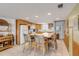 L-shaped kitchen with an island and light wood cabinets at 815 Ocean Shore Blvd # U9A, Ormond Beach, FL 32176