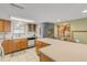 Bright kitchen with light wood cabinets, white appliances, and a large island at 815 Ocean Shore Blvd # U9A, Ormond Beach, FL 32176