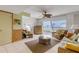Living room with ocean view, ceiling fan, and wicker furniture at 815 Ocean Shore Blvd # U9A, Ormond Beach, FL 32176