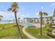 Resort-style pool with ocean views and lush landscaping at 815 Ocean Shore Blvd # U9A, Ormond Beach, FL 32176