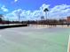 Community basketball court with basketball hoop, seating, and lake views at 9025 Savannah Julip Ln, Orlando, FL 32832