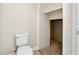 Cozy bathroom with toilet and a view into a closet area at 9025 Savannah Julip Ln, Orlando, FL 32832
