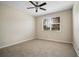 Bright and airy bedroom with neutral carpet, ceiling fan, and a window at 9025 Savannah Julip Ln, Orlando, FL 32832