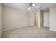 Large carpeted bedroom with ceiling fan and a door to the closet at 9025 Savannah Julip Ln, Orlando, FL 32832