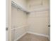 Walk-in closet featuring shelves and carpet flooring at 9025 Savannah Julip Ln, Orlando, FL 32832