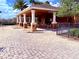 Covered outdoor community grill and dining area near pool with ample seating at 9025 Savannah Julip Ln, Orlando, FL 32832
