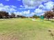 Sprawling community park with walking path and plenty of green space at 9025 Savannah Julip Ln, Orlando, FL 32832