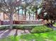 Beautiful community sign for Nona Terrace, surrounded by palm trees, flowers and a beautiful landscape at 9025 Savannah Julip Ln, Orlando, FL 32832
