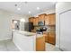 Modern kitchen with granite countertops, stainless steel appliances, and breakfast bar at 9025 Savannah Julip Ln, Orlando, FL 32832