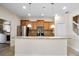 Updated kitchen featuring granite counters, stainless steel appliances, and ample storage at 9025 Savannah Julip Ln, Orlando, FL 32832