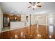 Bright open-plan living space with hardwood floors and modern finishes at 9025 Savannah Julip Ln, Orlando, FL 32832