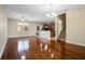Open concept living space with hardwood floors and ample natural light at 9025 Savannah Julip Ln, Orlando, FL 32832
