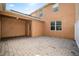 Rear view of patio with paved bricks and enclosed fence to provide privacy, offering a serene outdoor space at 9025 Savannah Julip Ln, Orlando, FL 32832