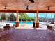 Community pool clubhouse with covered patio and plenty of table seating at 9025 Savannah Julip Ln, Orlando, FL 32832