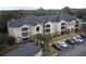 Apartment building with ample parking and landscaping at 940 Village Trl # 8-101, Port Orange, FL 32127