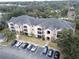 View of apartment building and surrounding landscape at 940 Village Trl # 8-101, Port Orange, FL 32127
