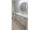 Updated bathroom with white vanity, marble countertop, and tile flooring at 940 Village Trl # 8-101, Port Orange, FL 32127