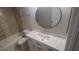Updated bathroom with a white vanity and marble countertop at 940 Village Trl # 8-101, Port Orange, FL 32127