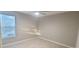 Bright bedroom with window and ceiling fan at 940 Village Trl # 8-101, Port Orange, FL 32127