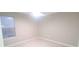Spacious bedroom with a ceiling fan and large window at 940 Village Trl # 8-101, Port Orange, FL 32127